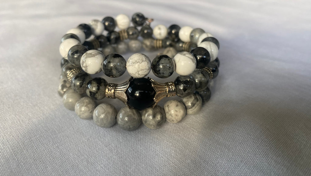 Guardian Angel Handmade Bracelet stacked on shades of gray.