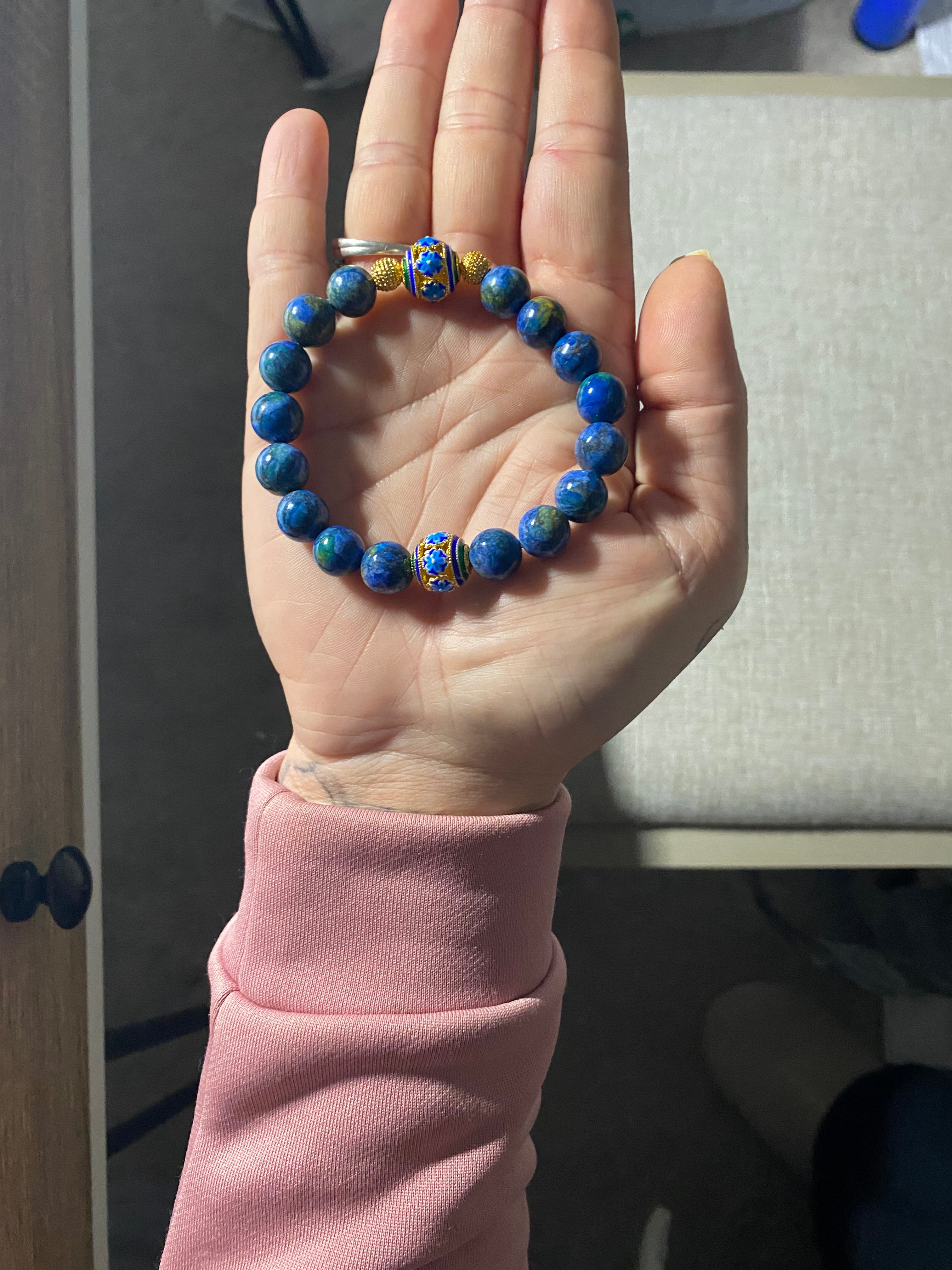 Handmade bracelet with swirls of Blue, green and gold